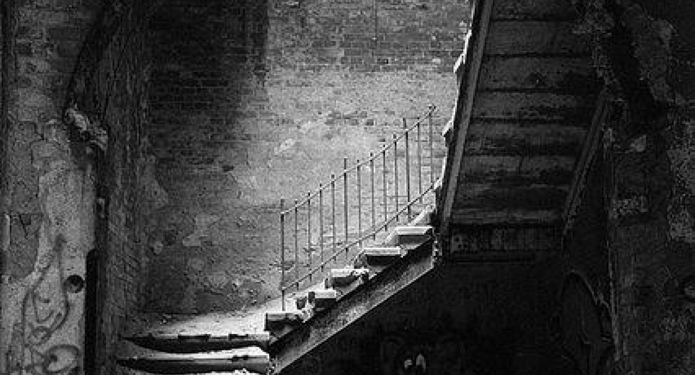 Although this abandoned hospital is in Beelitz Heilstaetten, Germany, in my mind Kelby is guided to the bottom of a rotting wooden stairway.